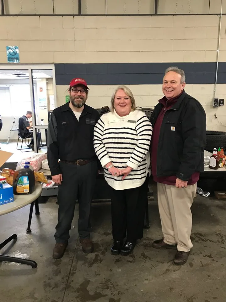 Three members at a community event