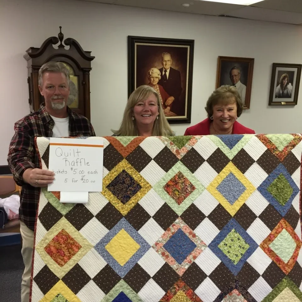 Quilt presentation and a gift of care, upright photograph