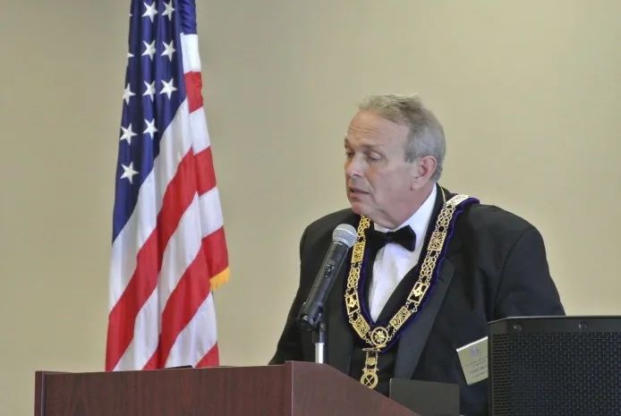 A Lodge member speaking at a podium