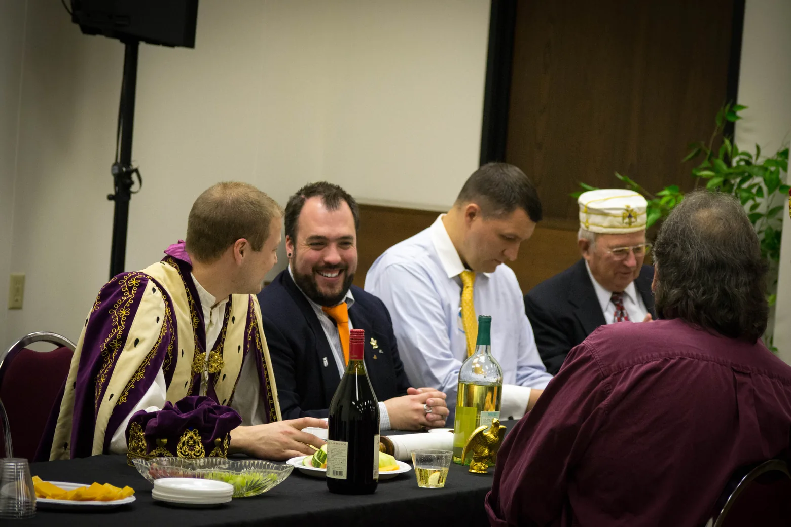 Brethren sharing conversation around a table