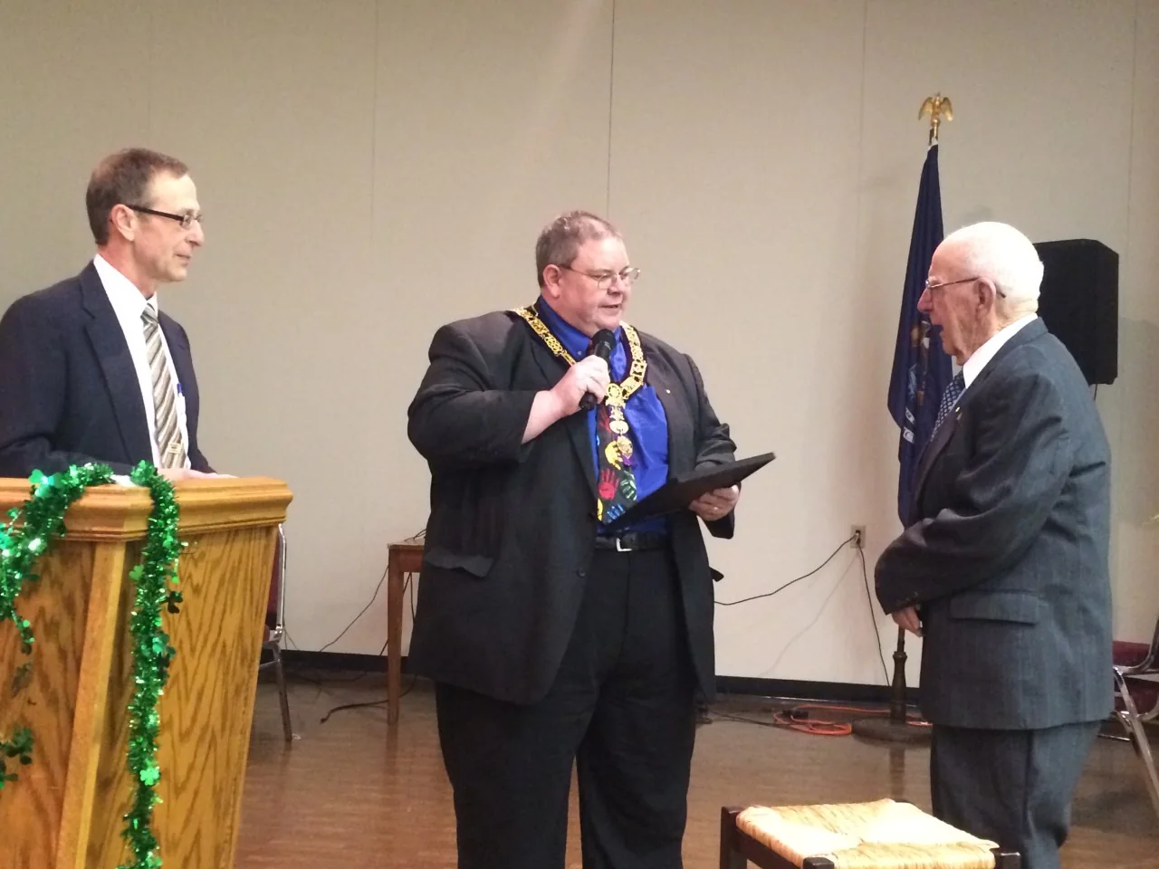 Three Lodge members at a presentation