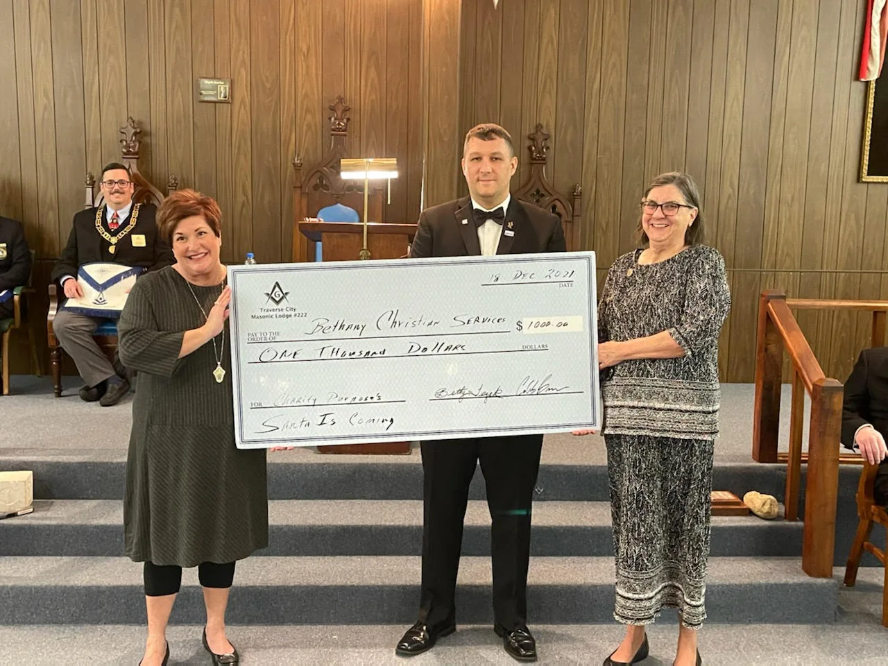 Members presenting a donation check