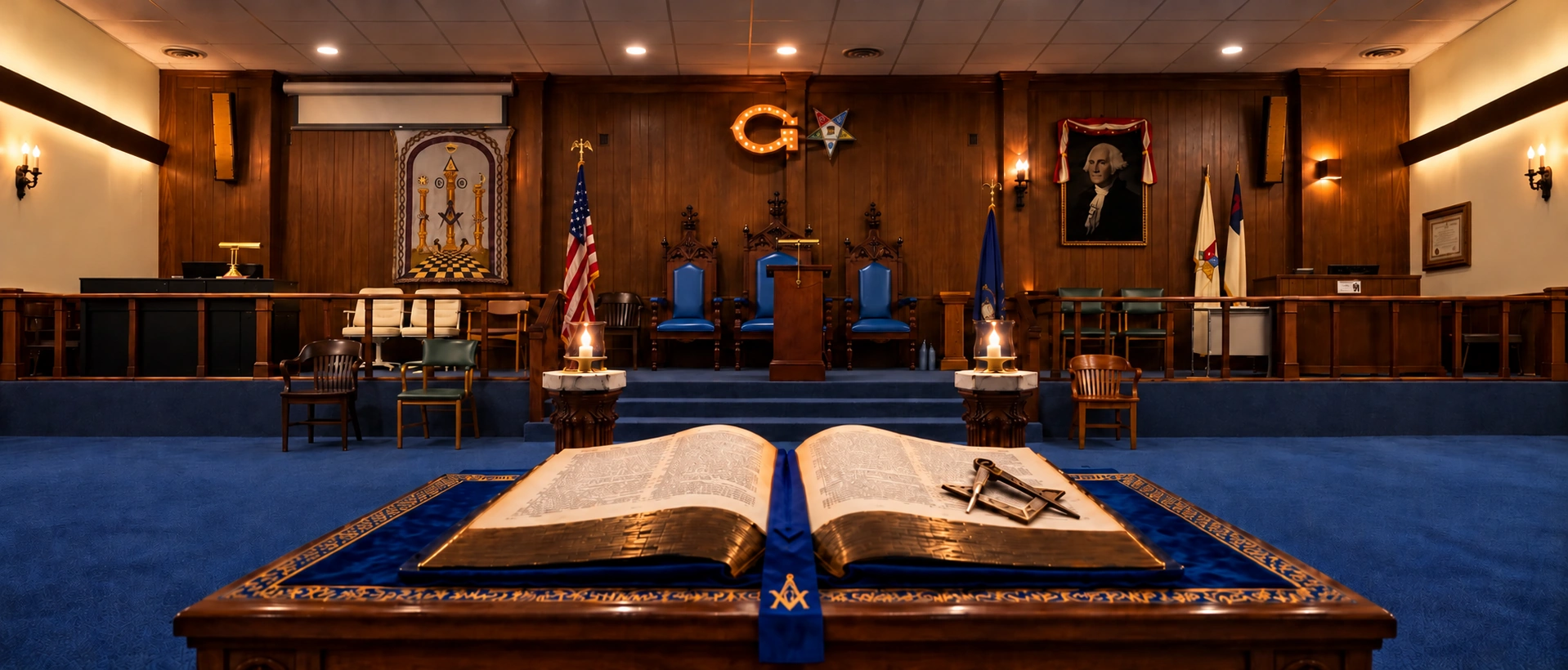 Traverse City lodge room with blue ceremonial furnishings, officers’ chairs, and an open book on the altar